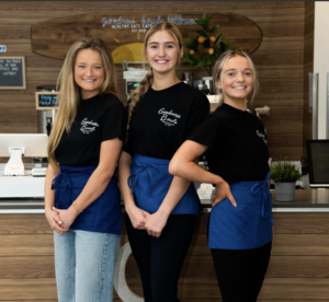 Three Goodness Bowls team members smiling in the cafe.